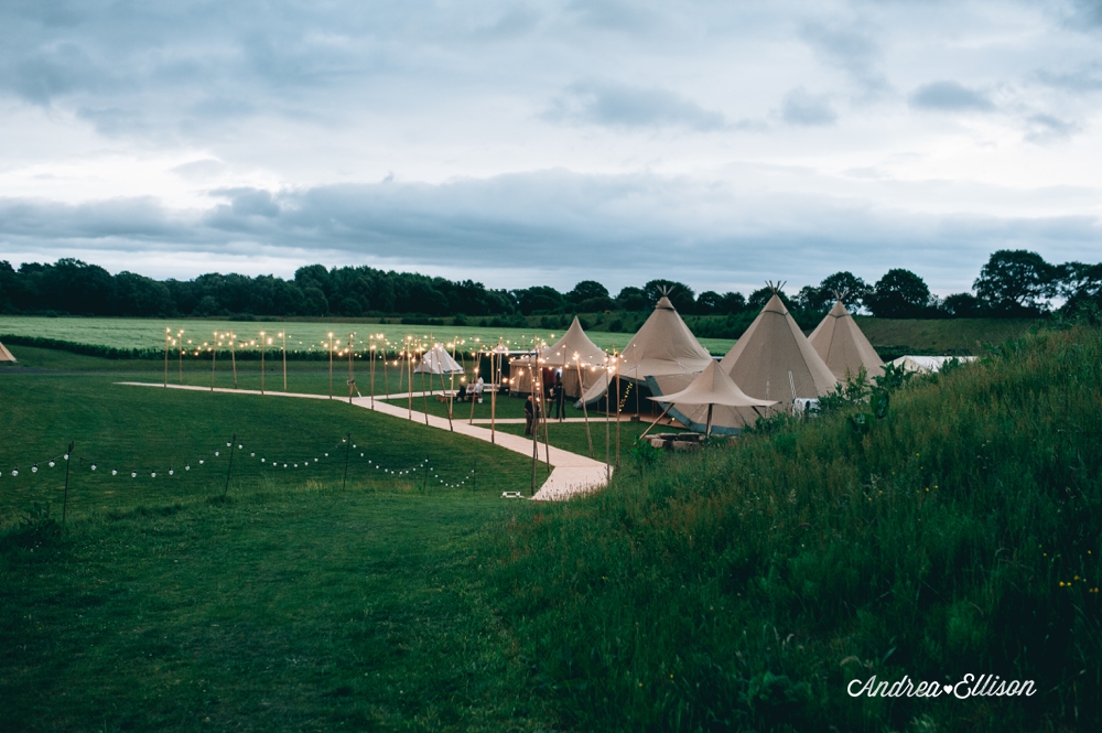 A wedding in a tipi in Delamere Forest with a bride wearing a Wilderness Bride wedding two piece wedding dress